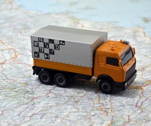 concept small white toy car on italy map